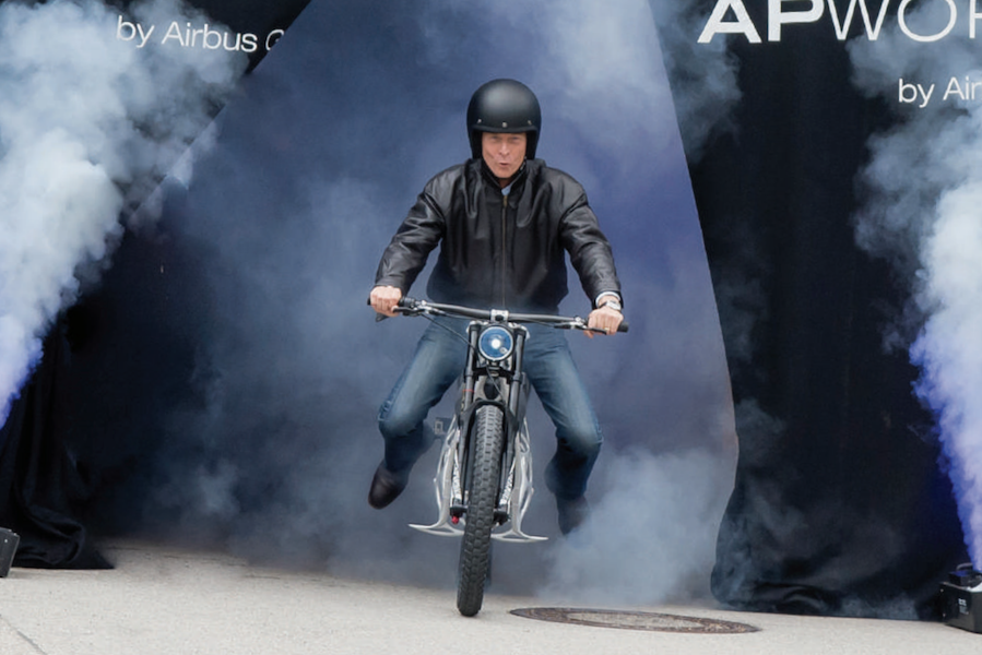 Airbus CEO riding a 3D-printed motorcycle through smoke