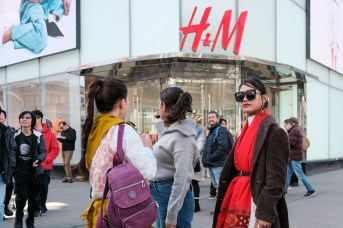 Shoppers outside an H&M retail store