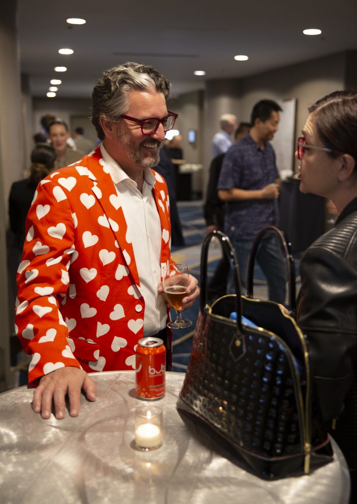 Attendees network at a pre-conference event.