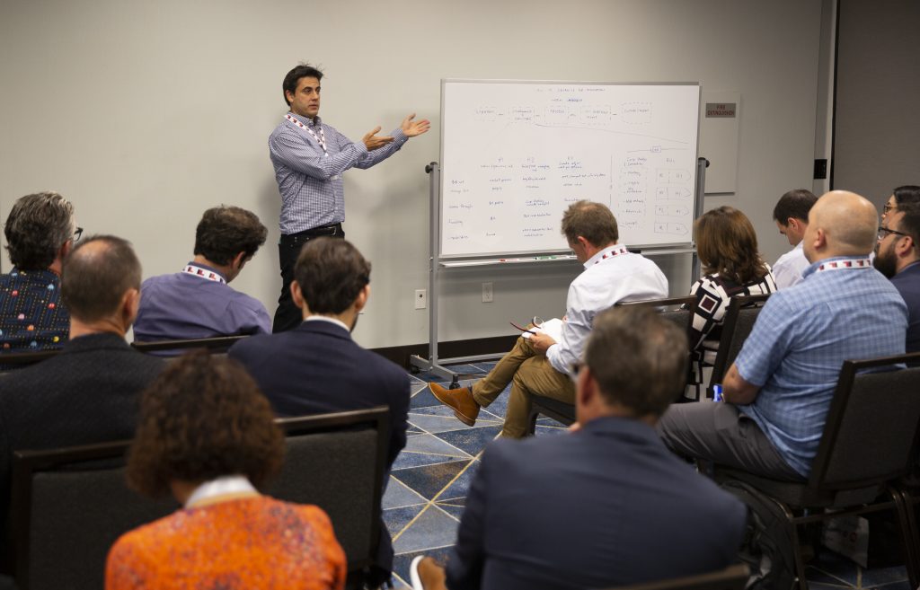 Fuat Koro, Head of Corporate Strategy & Ventures at Bose Corporation, leads a whiteboard session on governance and the ideal organizational structure for innovation groups