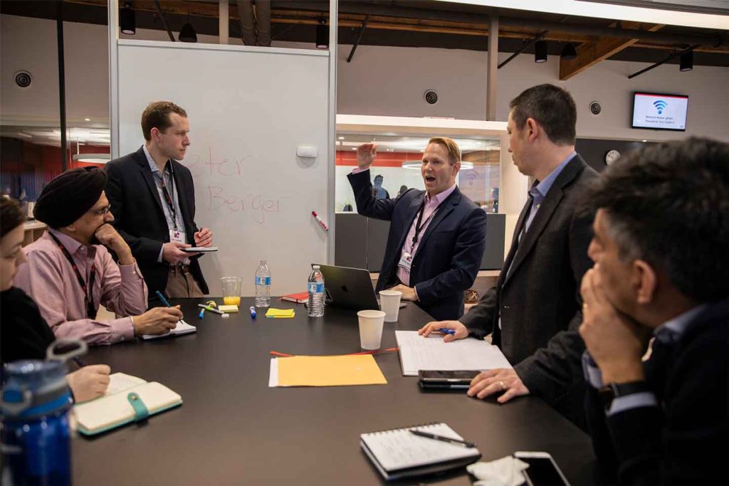 Peter Berger, Director of Innovation at EmbraerX, leads a session on metrics and KPIs for tech scouting work.