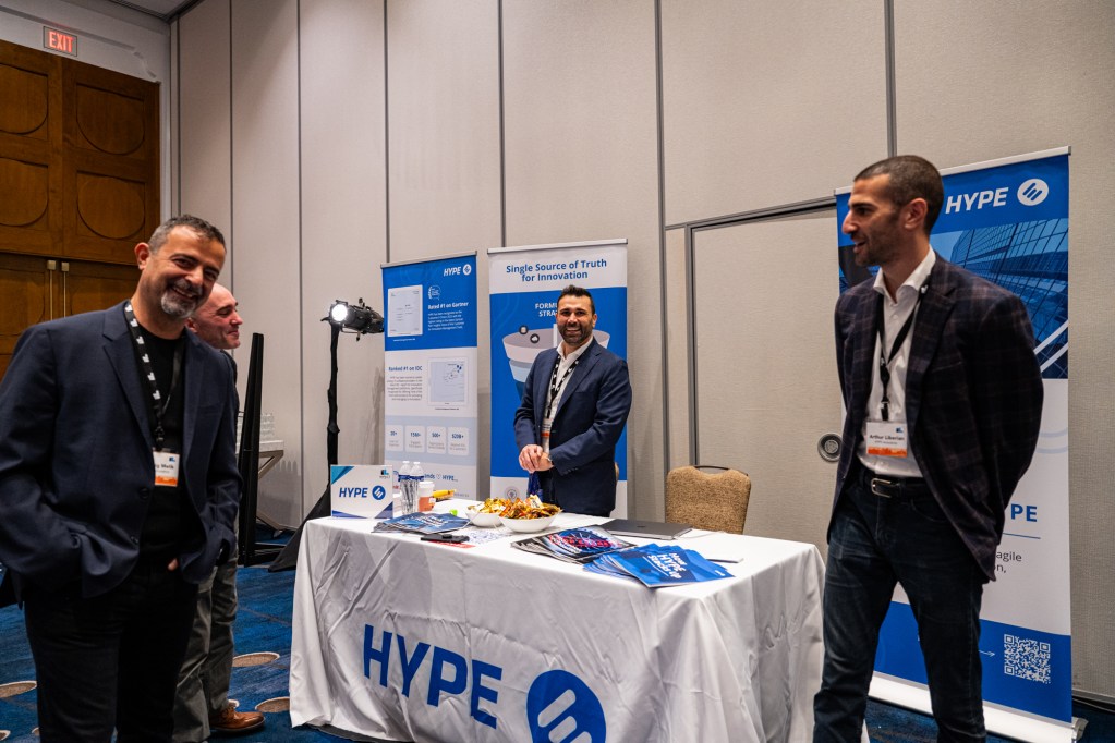 Ludwig Melik, Herman Kalaidjian, and Arthur Liberian at the HYPE Innovation booth.