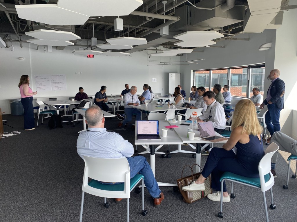 Meghan Hall of InnoLead moderates a session on generative AI tools.