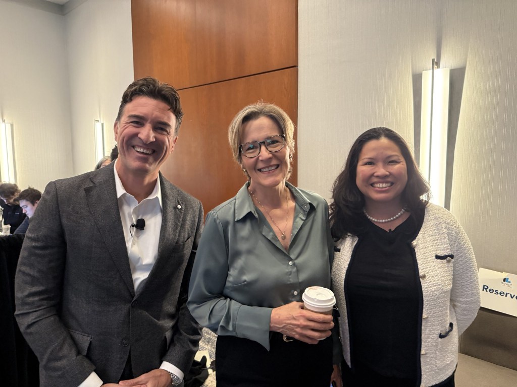 Gabriele Ricci of Takeda Pharmaceuticals, Abbie Lundberg of MIT Sloan Management Review, and Jit-Kee Chin of Suffolk Construction get ready to take the stage.