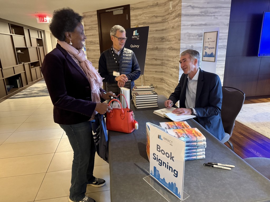Scott Anthony signs copies of his new book, “Epic Disruptions.”