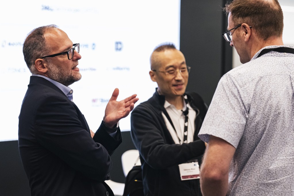 Amedeo Conti of Shell Techworks talks with Sokwoo Rhee of LG Electronics and Ross Richardson of SharkNinja.