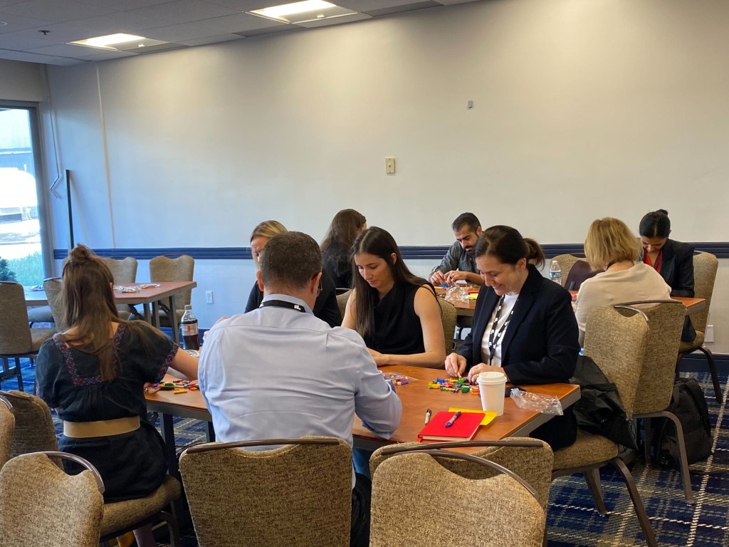 Participants use LEGO bricks as part of “A Hands-On LEGO SERIOUS PLAY Exploration.”