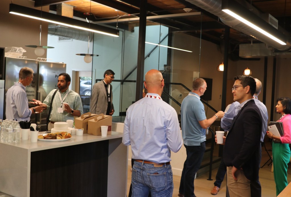 Attendees spend time networking over breakfast before the main sessions begin.
