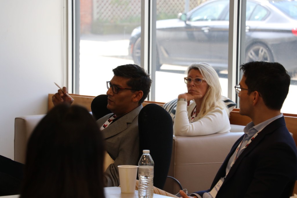 Prashant Srivastava of Innosight shares ideas in the opening session while Diana Nicholson of Fidelity Investments and David Arazawa of Hologic listen.