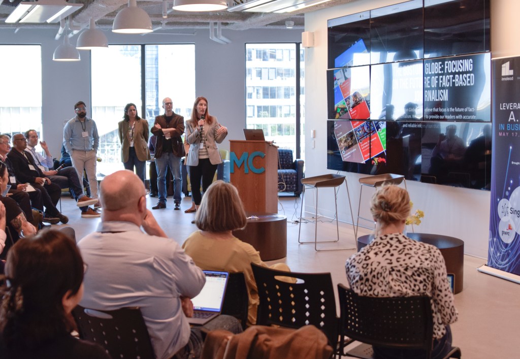 Michelle Micone of Boston Globe Media Group presents her team’s work.