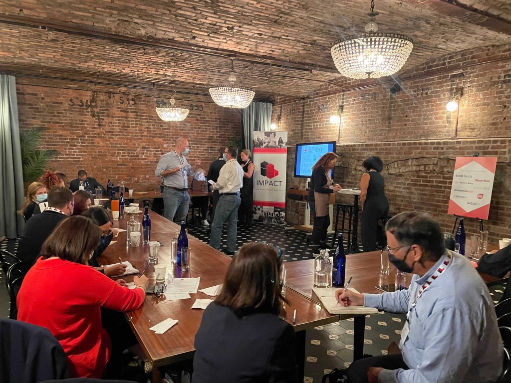 Participants dive into a paired activity at the Impact Executive Forum in New York.