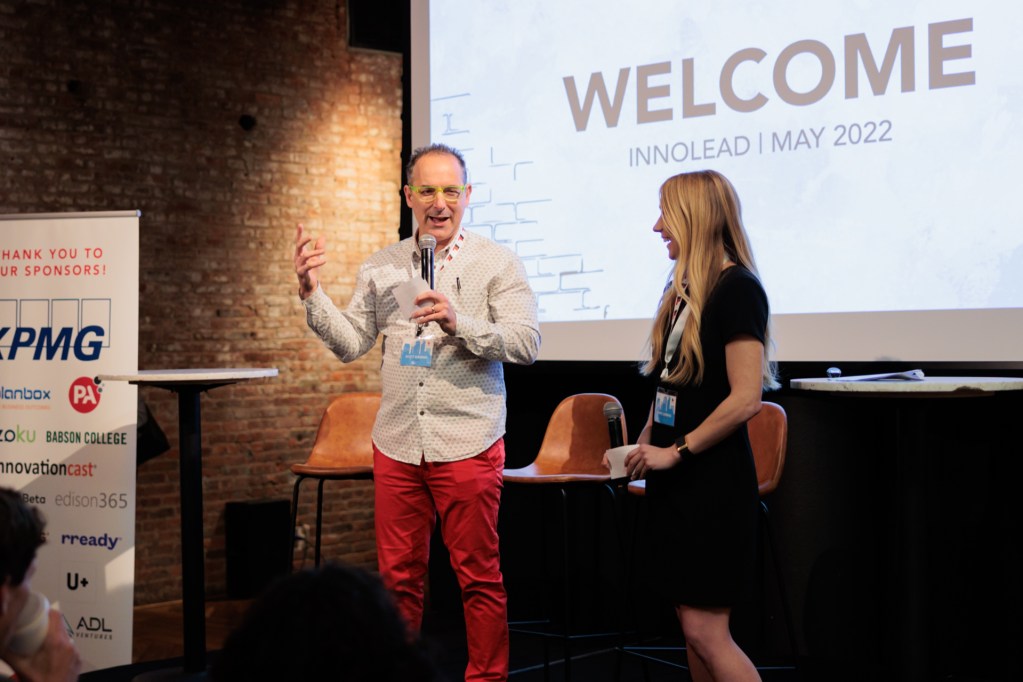 Scott Kirsner, CEO & Founder of InnoLead, and Parys Zambas, Senior Event Producer at InnoLead, welcome attendees back for day two of Impact NYC.
