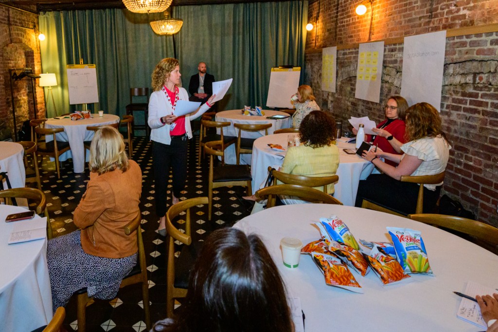 Tracy Rossettini, Senior Director of Research & Devlopment at Hain Celestial Group, leads a breakout session focused on food trends in 2022, where attendees brainstormed and participated in culinary taste tests.