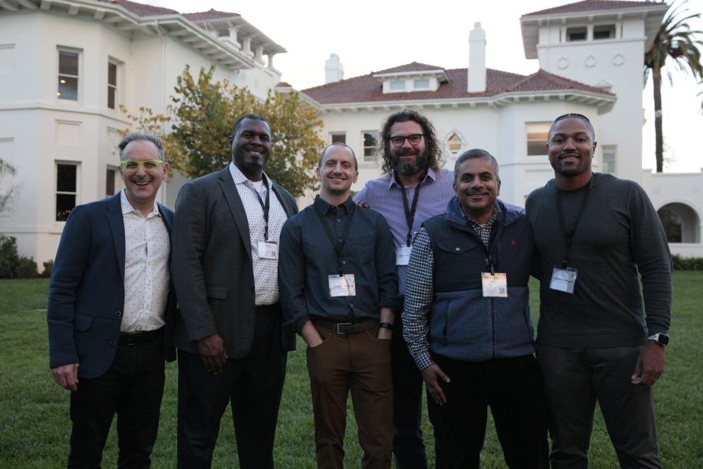 InnoLead’s Scott Kirsner poses with attendees from Procter & Gamble (from left): David Gladney, Jeremy Carter, Corey Bischoff, Hari Nair, and Jarenn Stewart during a networking cocktail hour.